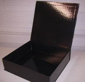 tray bound within three piece outer case